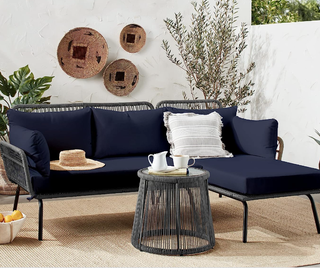 navy blue l-shaped sofa and matching woven table