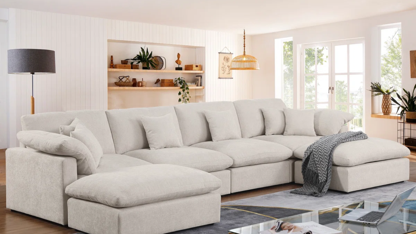 a living room with a large beige couch