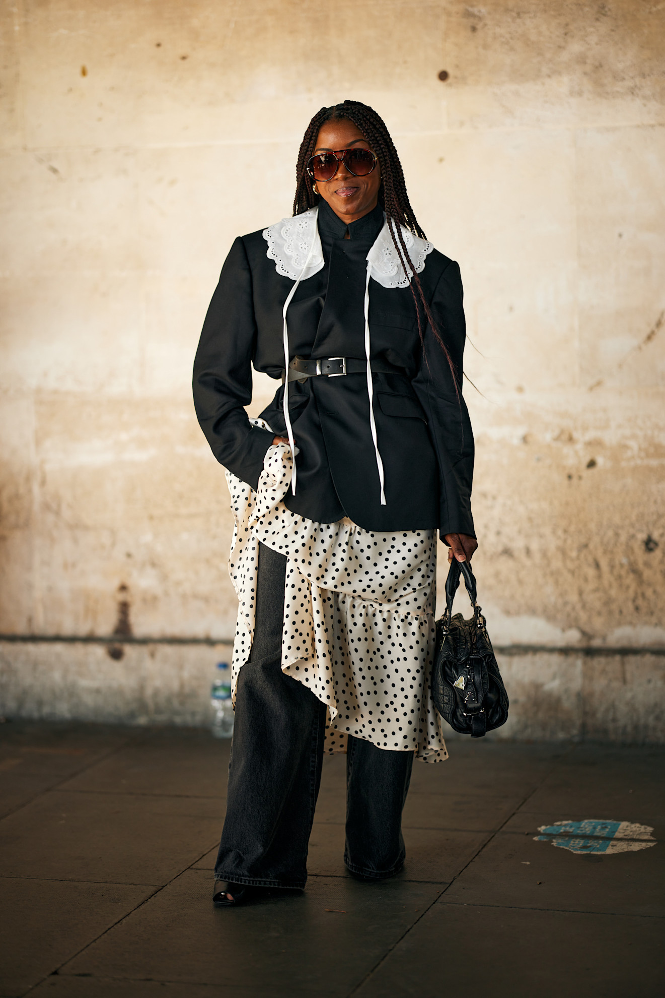 Woman wearing a dress layered over jeans