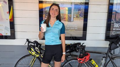 Ellie Donnell at train station with bikes and coffee