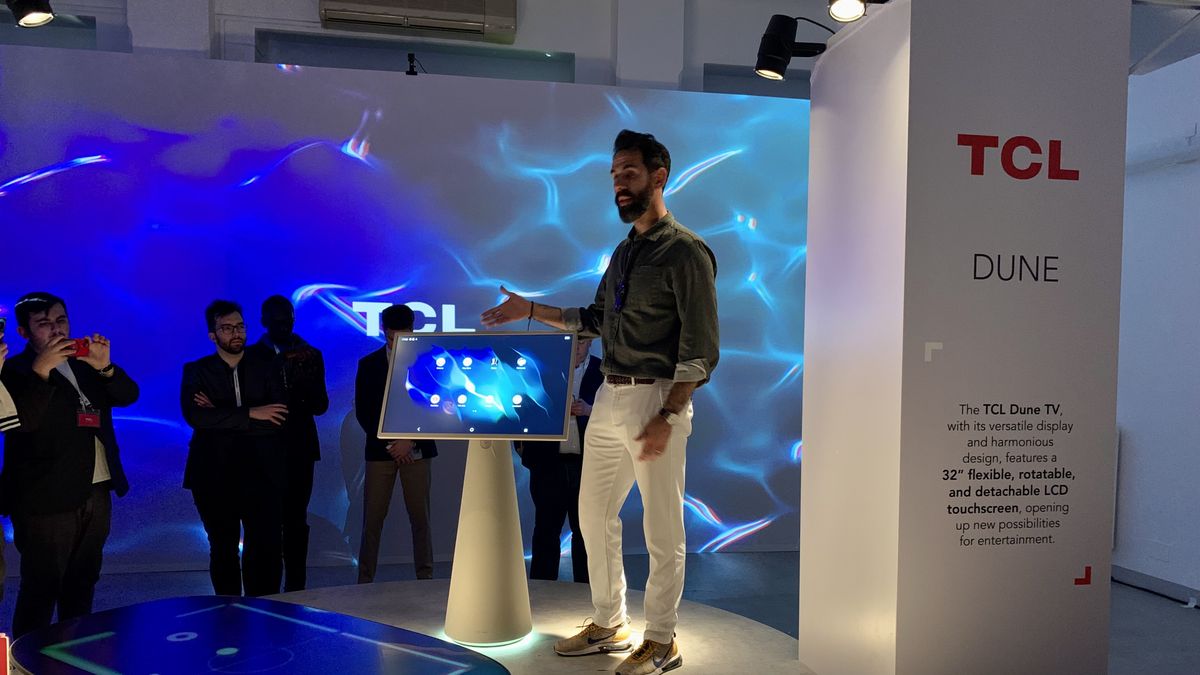 TCL Dune TV in portrait mode, at Milan Design Week, in a white and water-themed room