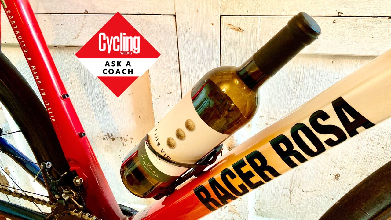 A bottle of wine in a bottle cage, with the &#039;Ask a Coach&#039; roundel