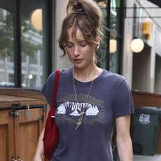 Jennifer Lawrence was spotted at dinner in New York City. The actress kept it effortlessly chic in a casual gray T-shirt, a long white skirt, and brown toe-loop sandals for the evening outing.