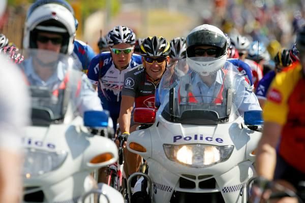 Lance Armstrong (RadioShack) rides behind a Police escort during the mass bunch ride.
