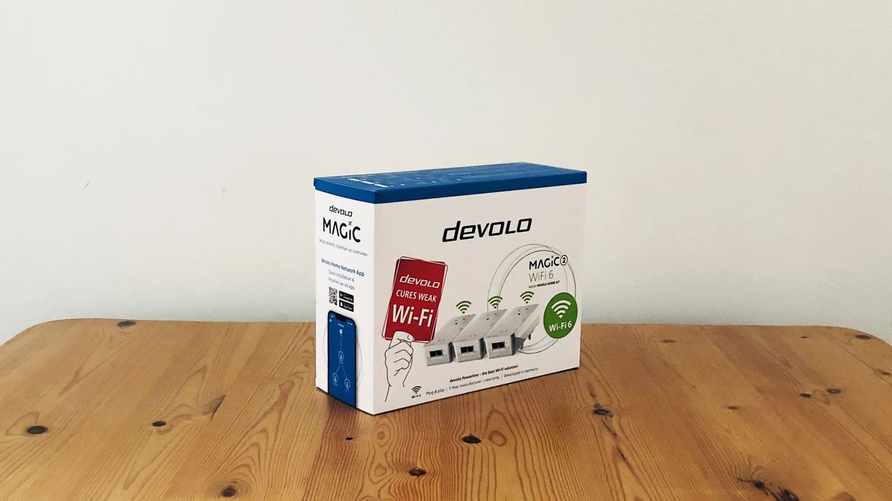 Devolo Magic 2 Wi-Fi 6 Mesh on a wooden desk