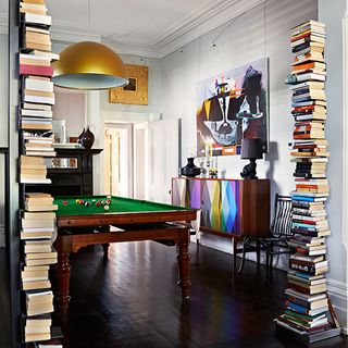 double book stack with visible shelves and hanging light