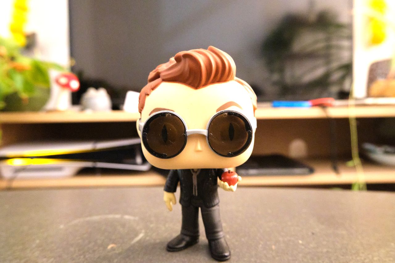 A Funko Pop figure of Crowley from Good Omens, taken on a Fujifilm X-M5 mirrorless vlogging camera