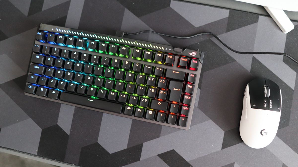 The Asus ROG Falchion Ace 75 HE on a desk with the lighting enabled.