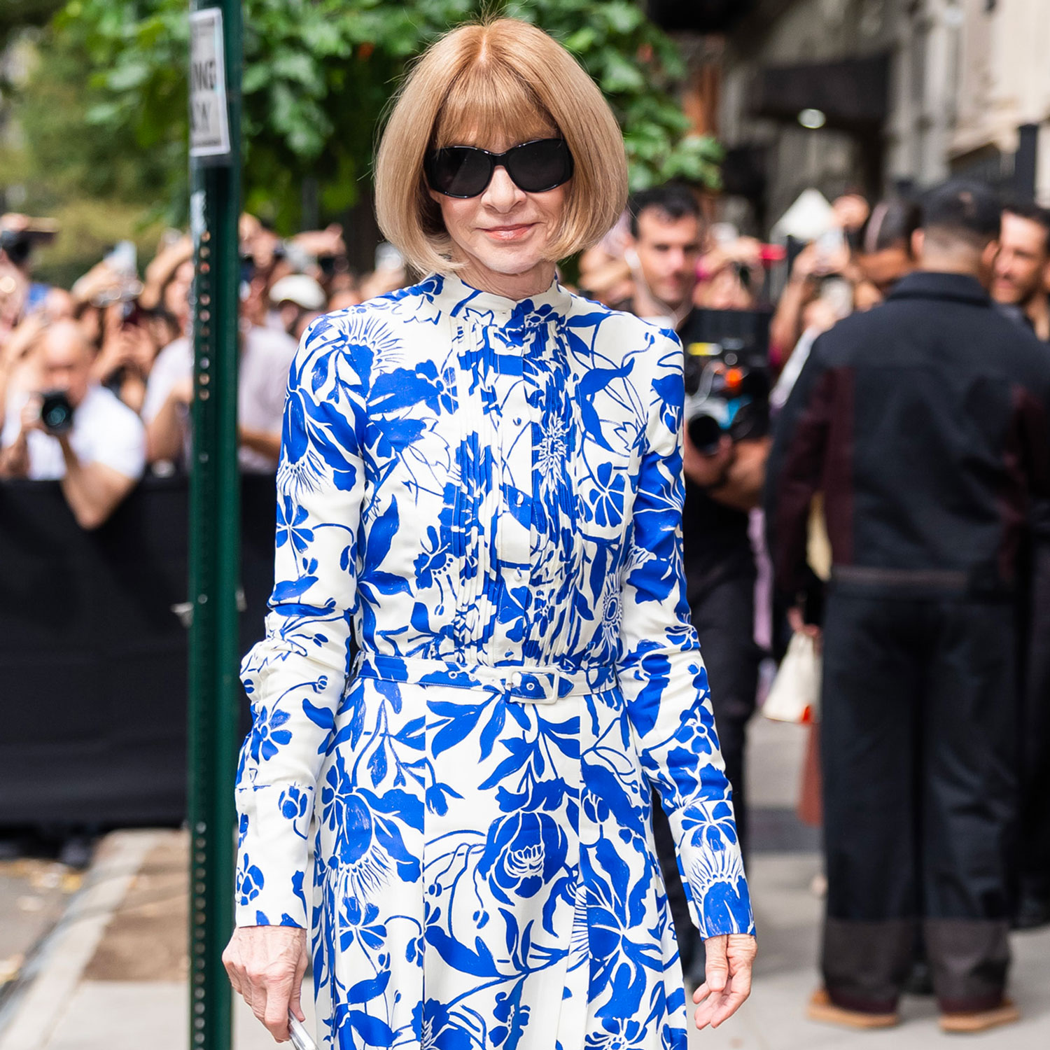 Anna Wintour wears a blue and white floral dress