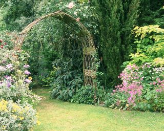 willow arch in a cottage style garden