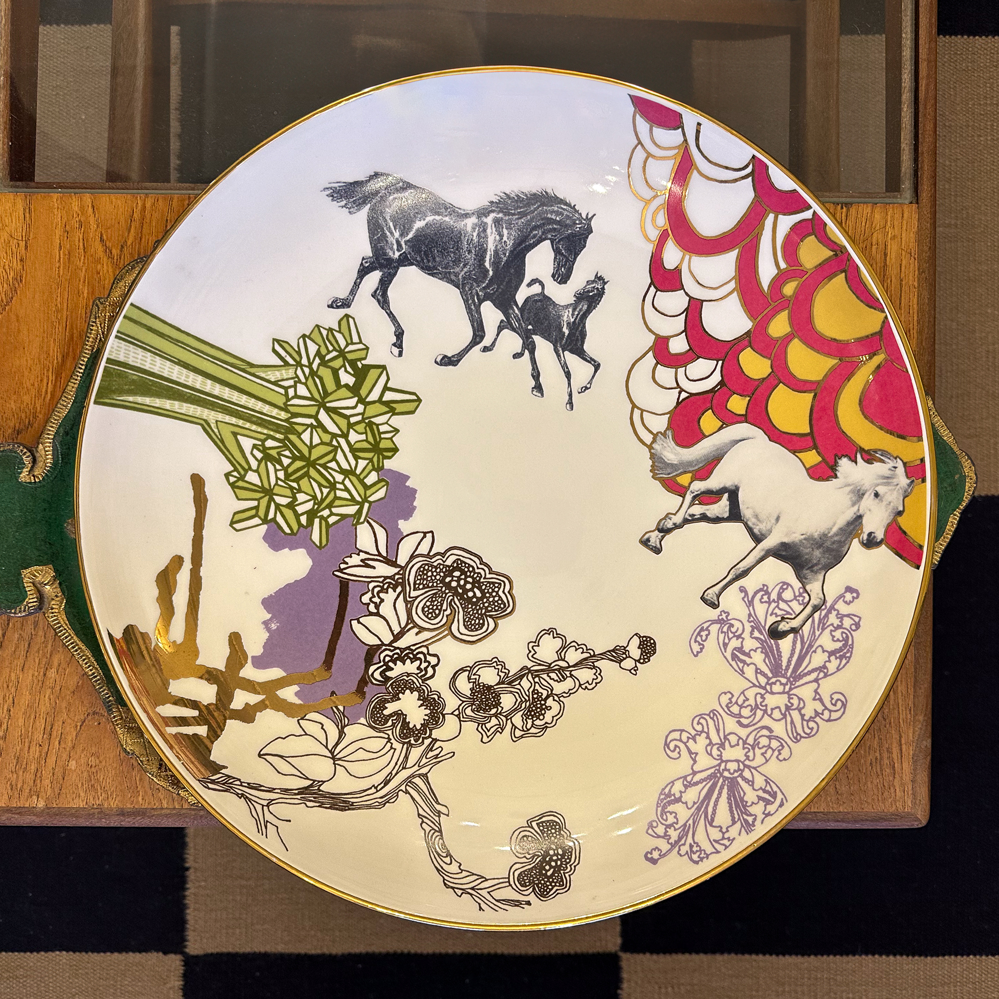 Habitat bowl with horses on it pictured from above on a wooden coffee table