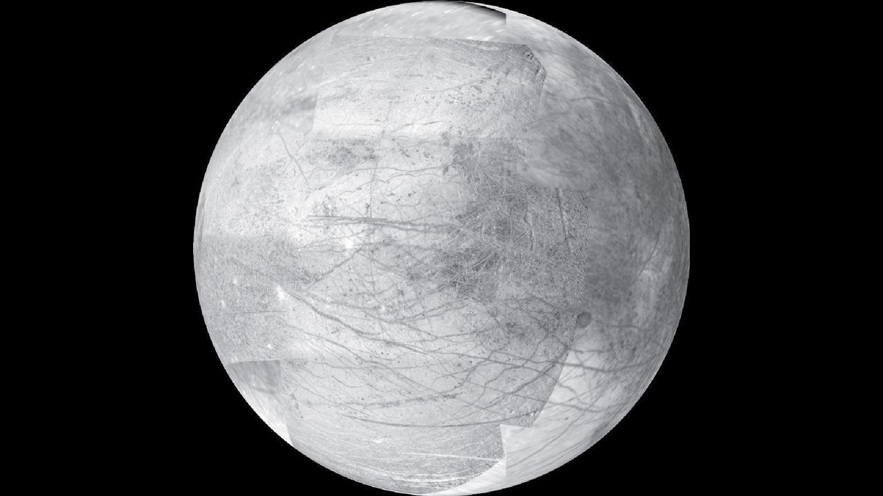 A white moon with gray crevices across its face