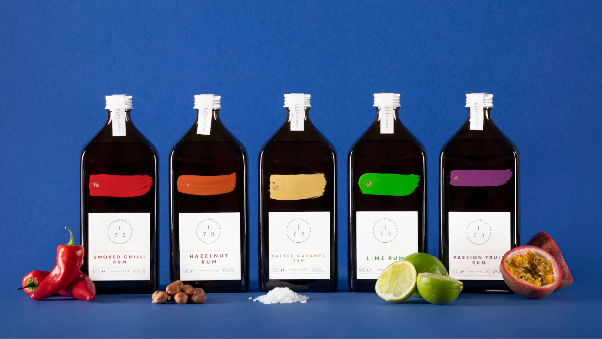a line up of five of Project #173&#039;s rums. From Left to right they are: smoked chili, hazelnut, salted caramel, lime, and passionfruit.