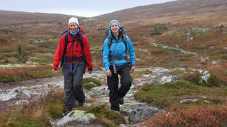 How to camp in the rain: two women hiking in wet weather