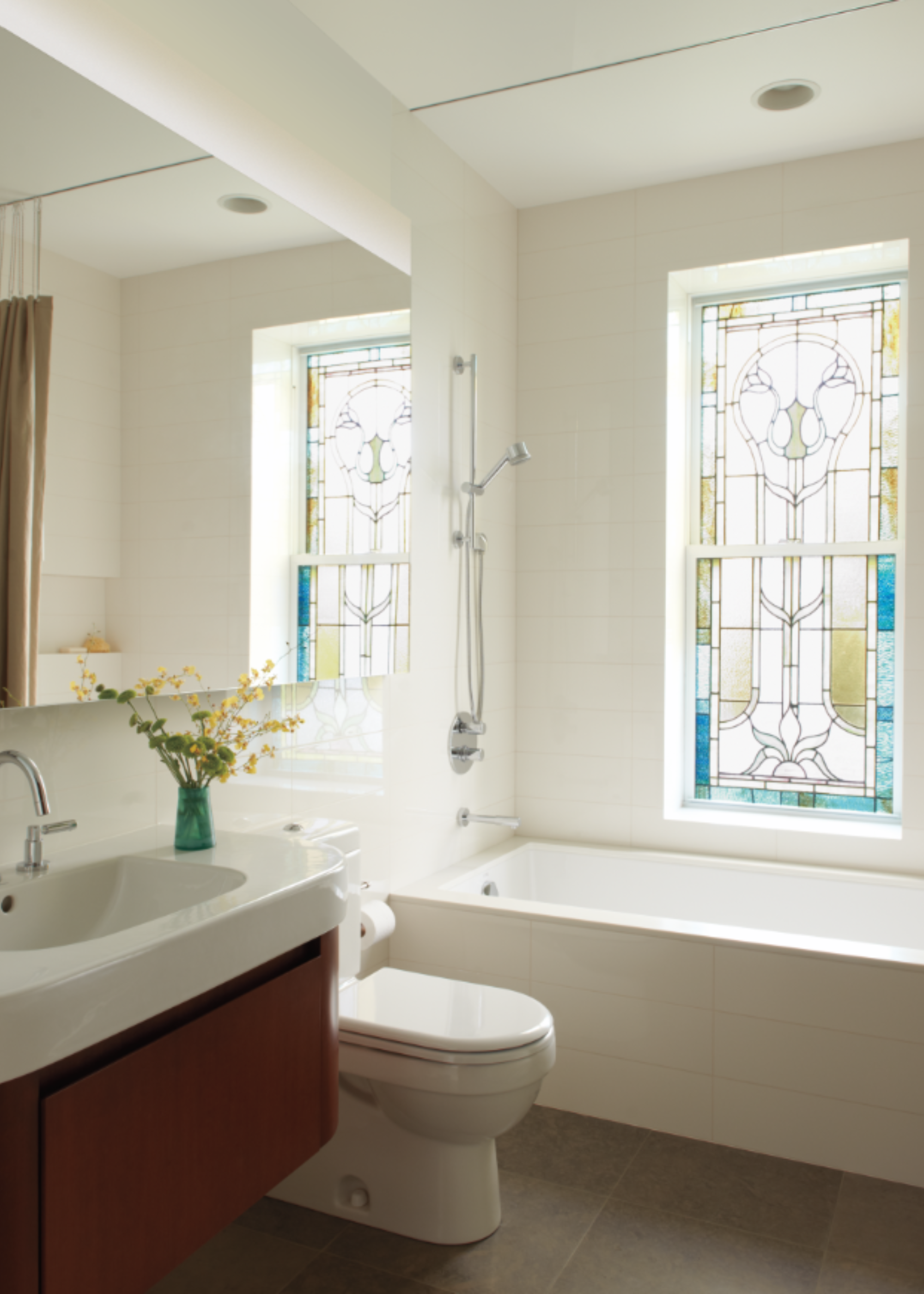 A bathroom with stained glass windows