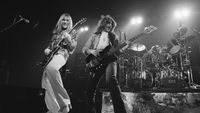 Alex Lifeson (left) and Geddy Lee performing with Rush at the Civic Center in Springfield, Massachusetts in 1976. Neil Peart is on drums (right)