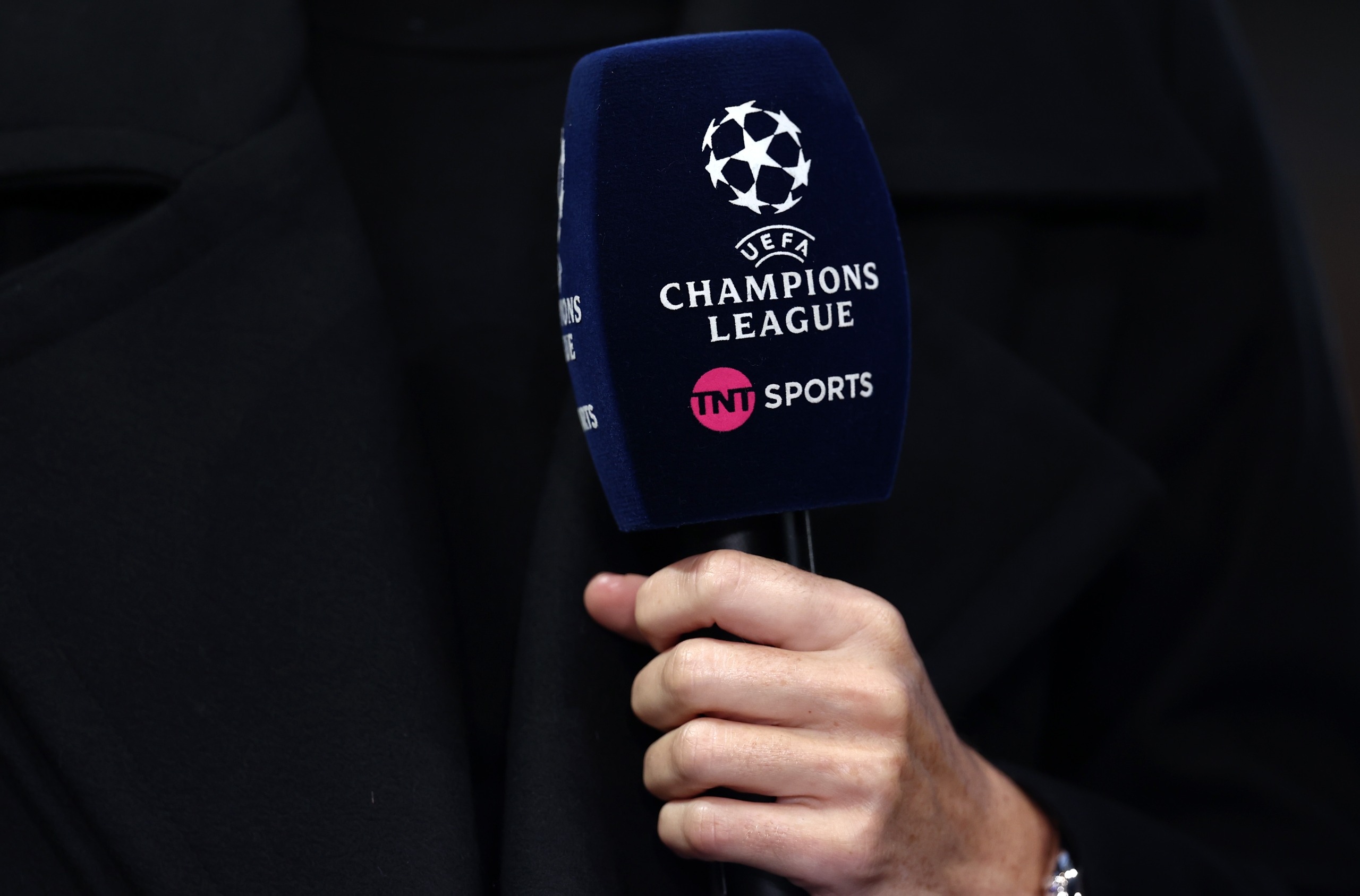 A TNT Sports microphone with the UEFA Champions League logo