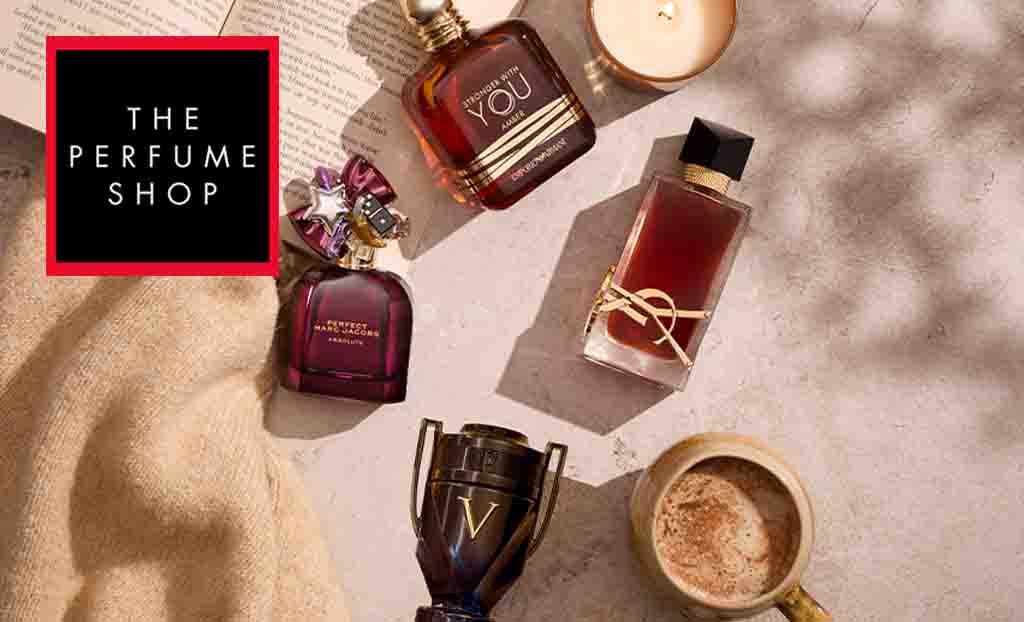 The Perfume Shop logo top left with a top down view on four perfumes, next to a mug of coffee, candle, book and scarf