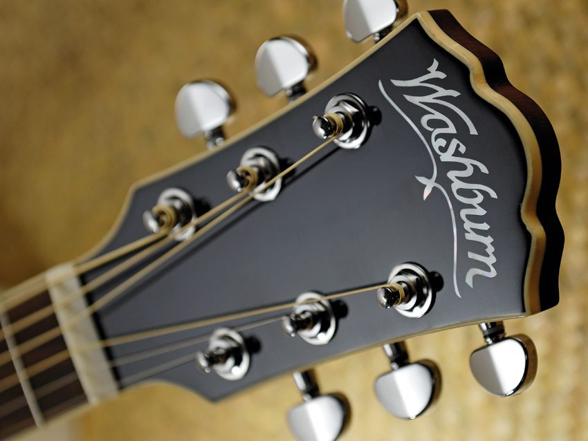 There's some evidence of retro-filling where the Washburn's headstock angles away from the neck.