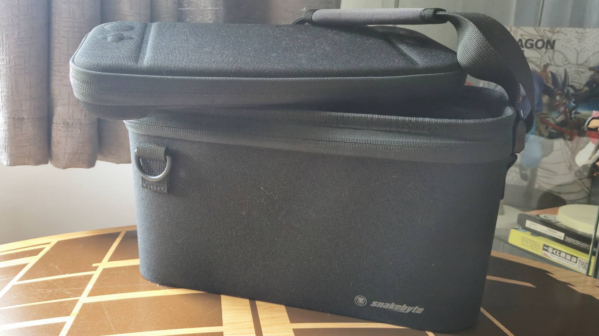 Photo by Rosalie Newcombe of the Switch 2 Snakebyte case sitting on a coffee table.