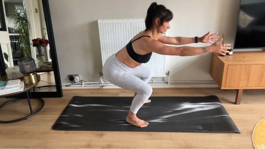 Sam performing a bodyweight squat