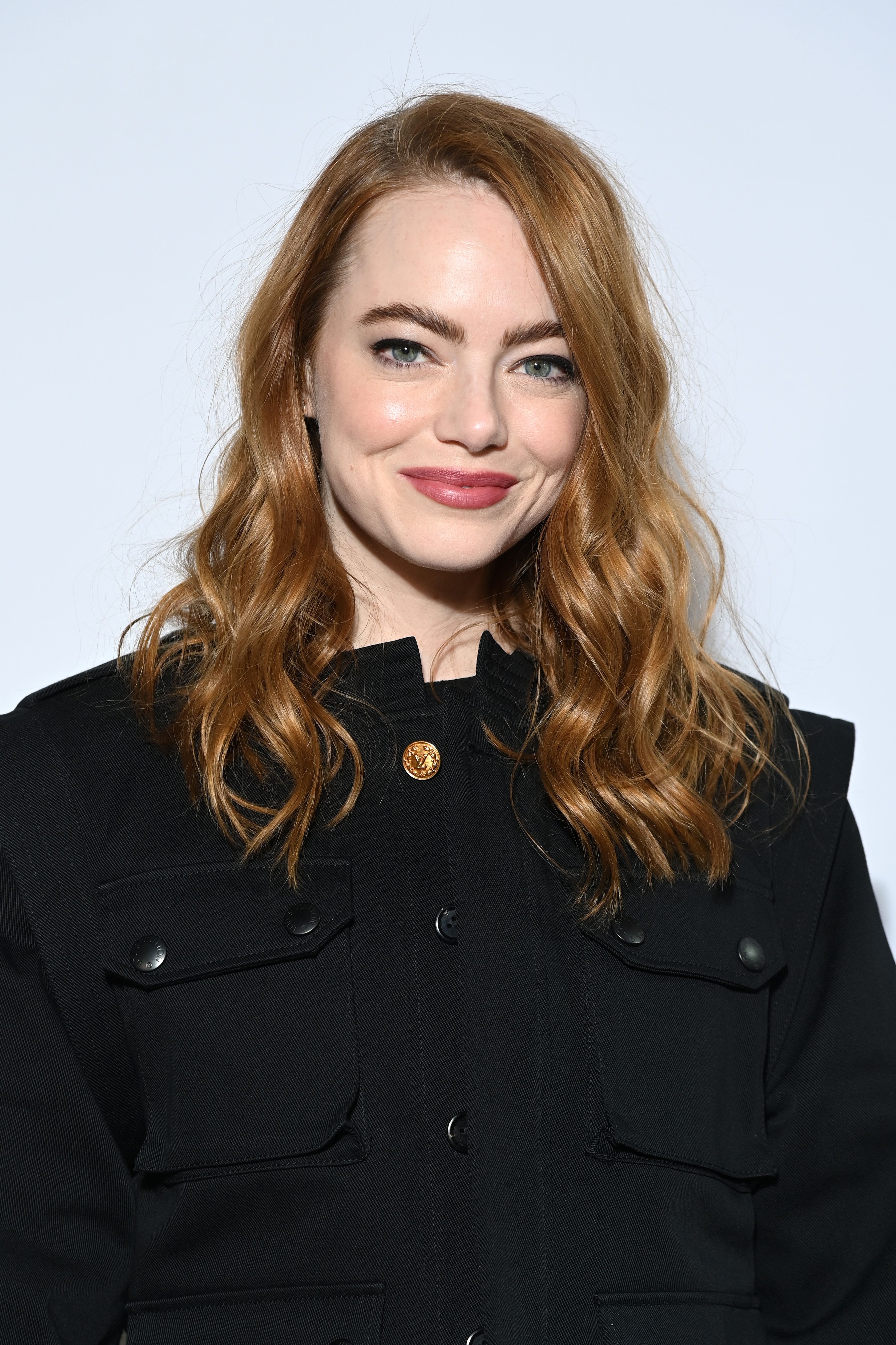 Emma Stone attends the Louis Vuitton Womenswear Fall/Winter 2022/2023 show as part of Paris Fashion Week on March 07, 2022 in Paris, France