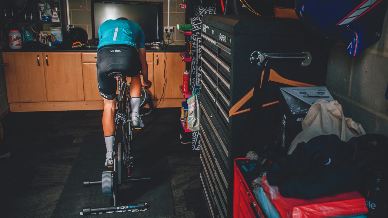 Image shows cyclist riding cheap turbo trainer