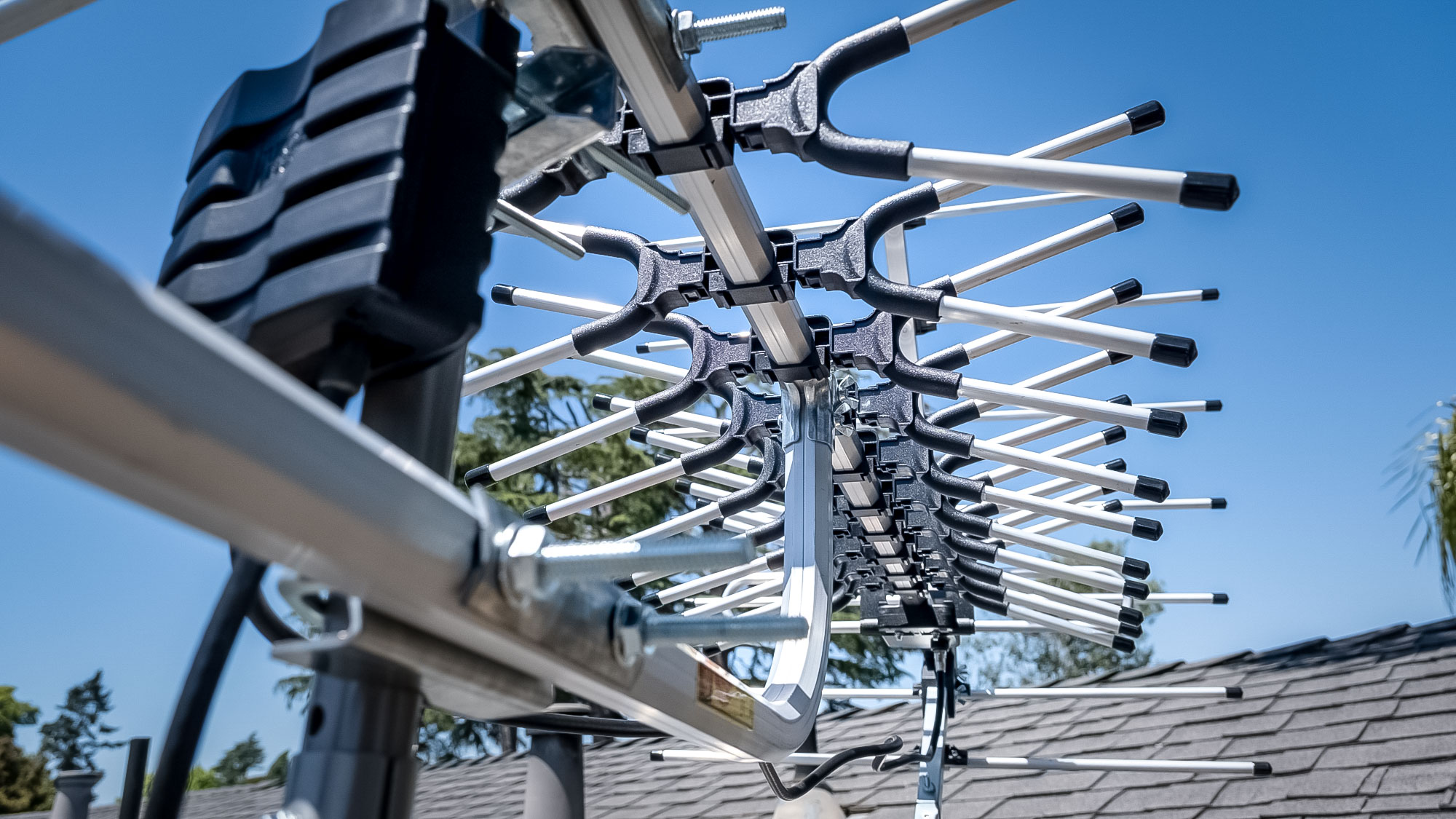 A close up of Antennas Direct Goliath TV antenna on the roof of a house.