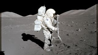 Harrison Schmitt on the surface of the moon collecting samples from the lunar surface. 