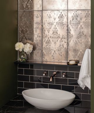 A bathroom mirror idea using antique effect mirrored tiles