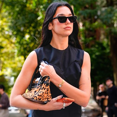Dua Lipa went on vacation with Callum Turner in a vintage John Galliano leopard-print slip dress