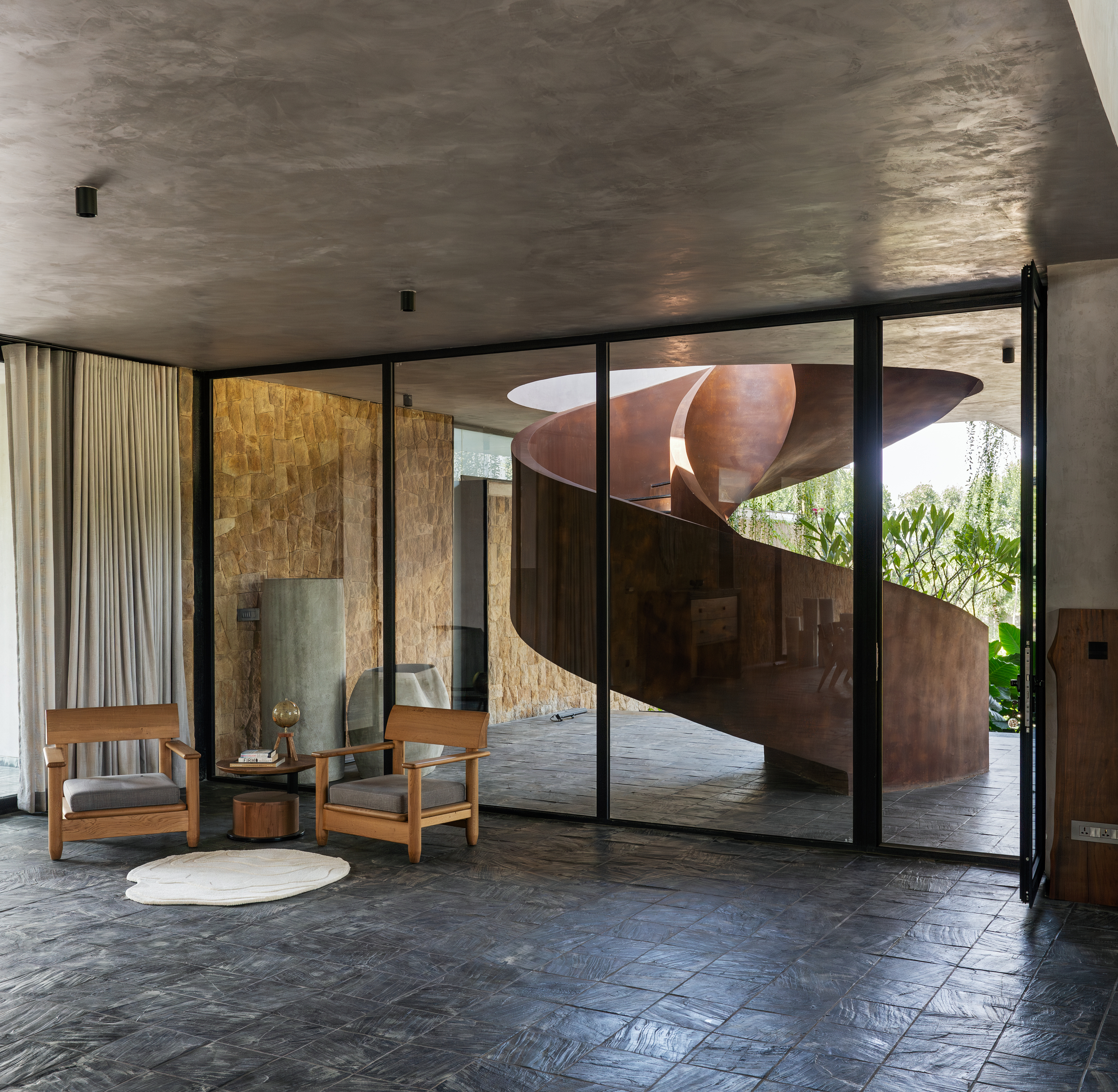 hyderabad home in brutalist style covered in greenery by 23 Degrees Design Shift