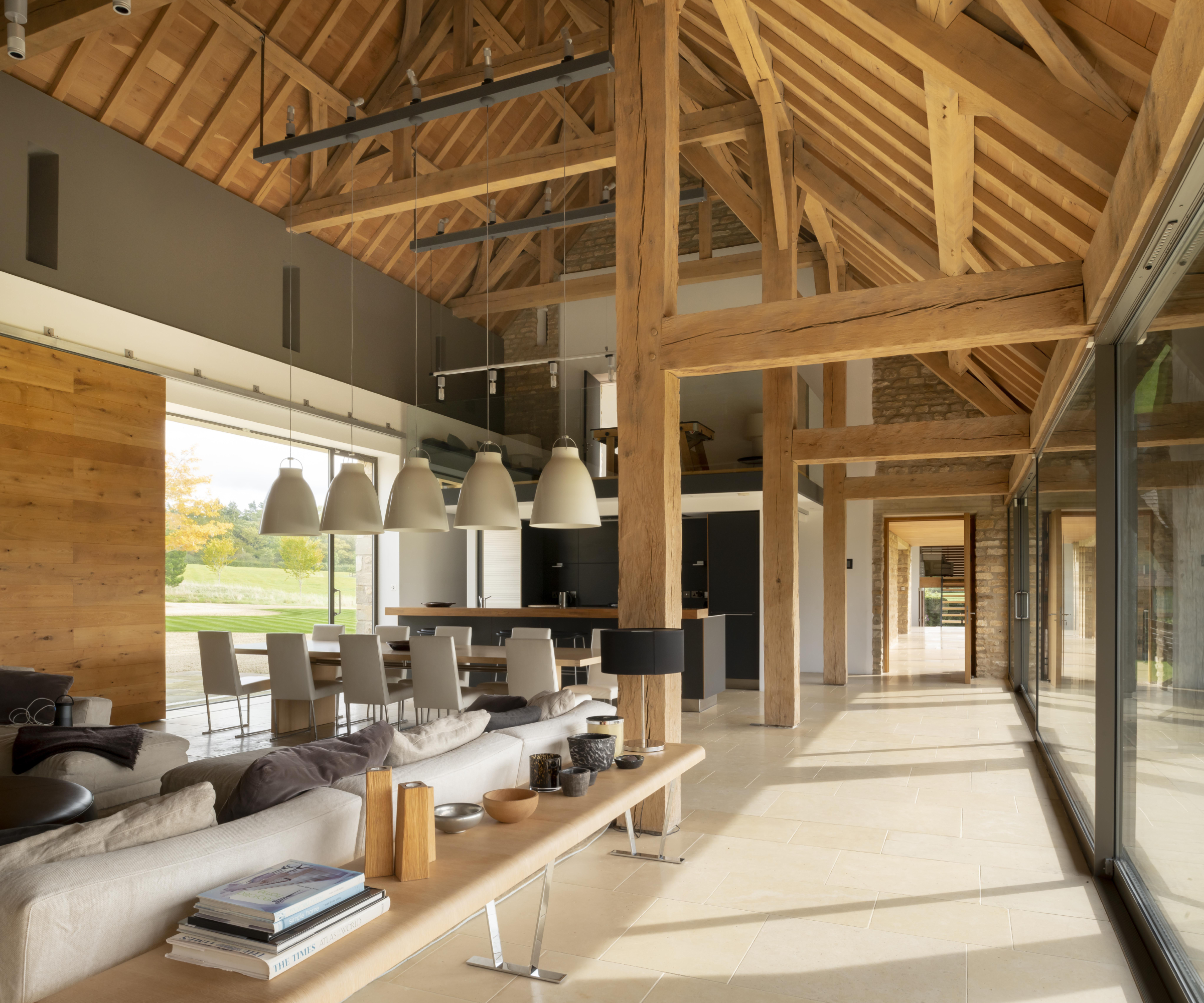 inside of single storey timber frame home with open plan living space and small mezzanine above kitchen