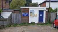A former police office with a car park in front