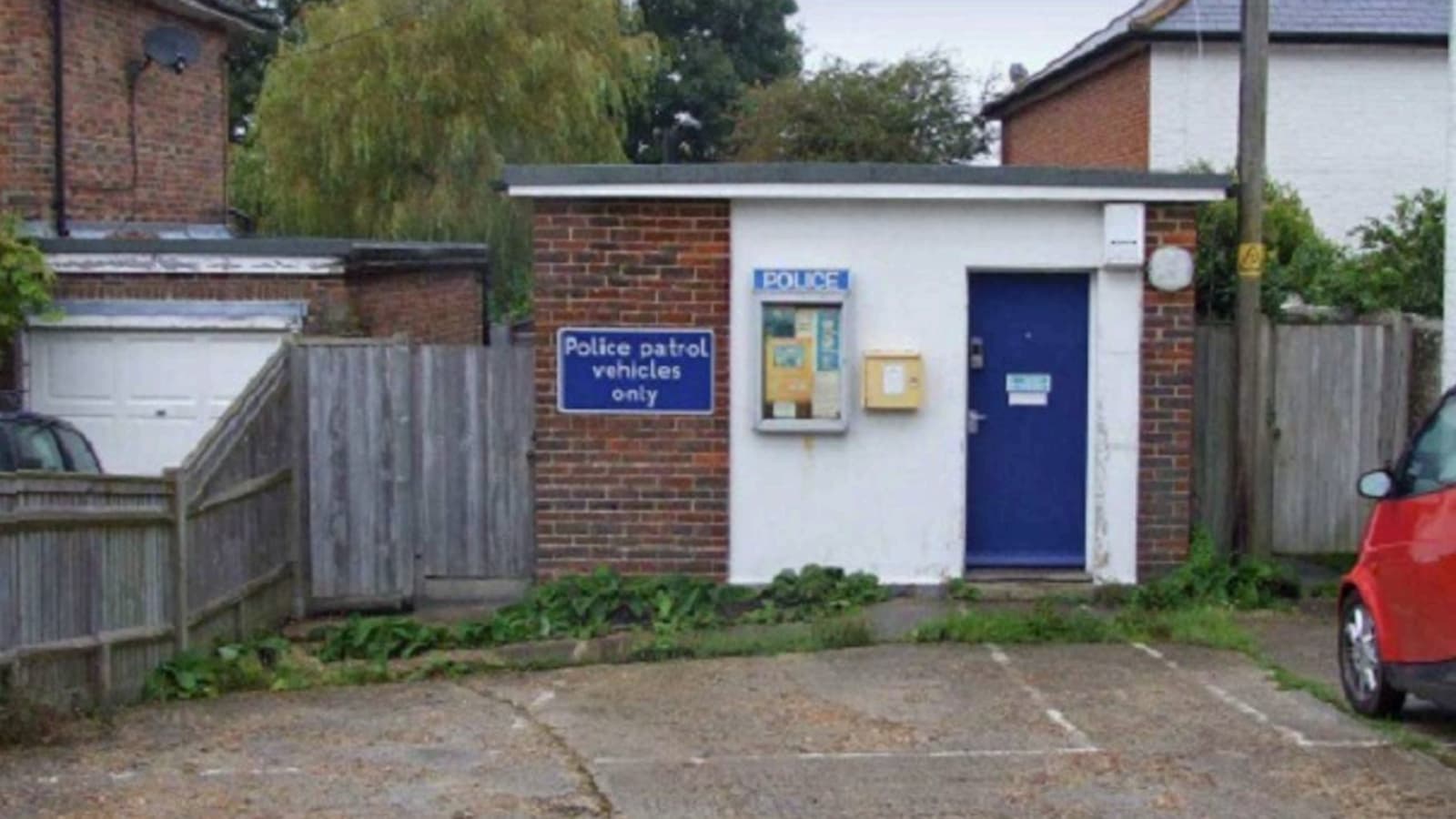 A former police office with a car park in front