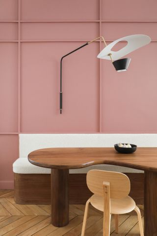 A dining room painted pink
