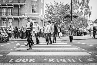 Image of a schoolboys walking across Abbey Road crossing, in black-and-white, taken on the Sigma 18-50mm f/2.8 DC DN | C Canon RF