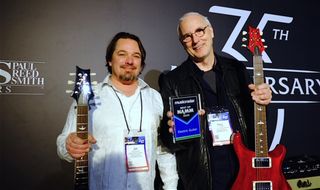 Paul Reed Smith (right) and PRS Director of sales Jim Cullen holding a pair of MusicRadar award-winning S2 594 McCarty models 