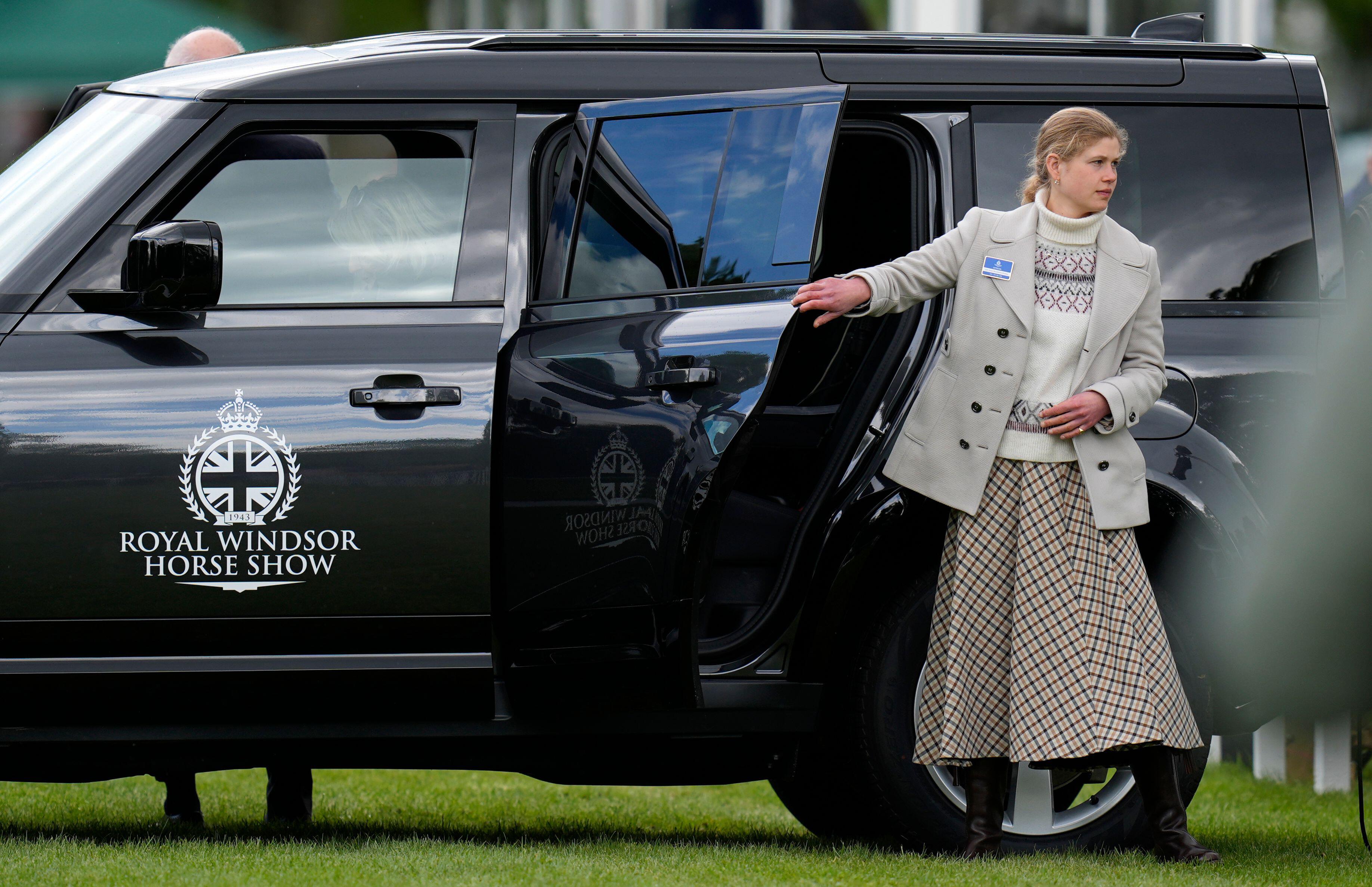 Lady Louise getting out of a car in a blazer and skirt