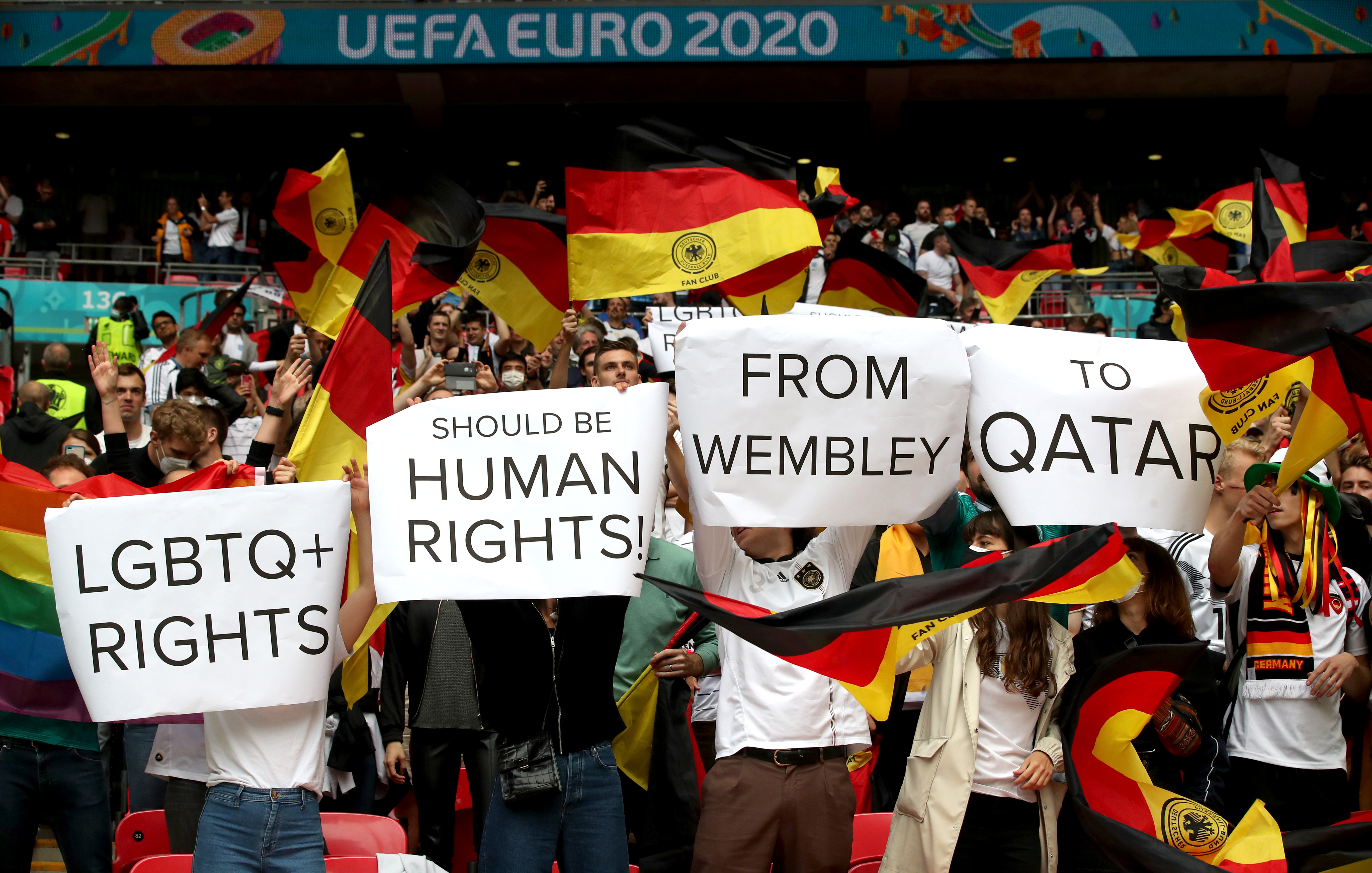 Germany fans hold up signs at Wembley at Euro 2020