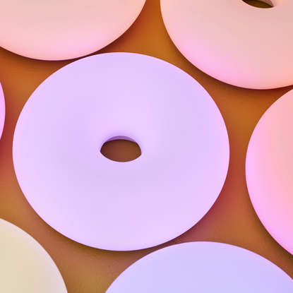 IKEA smart doughnut lamp lit up with a purple glow.