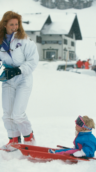 Sarah Ferguson, Duchess of York pulls her daughter Princess Beatrice of York in the snow during a skiing trip to Klosters, Switzerland, 12th January 1991