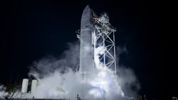 SpaceX's Starship is tested at night as the spacecraft vents into the spotlights.