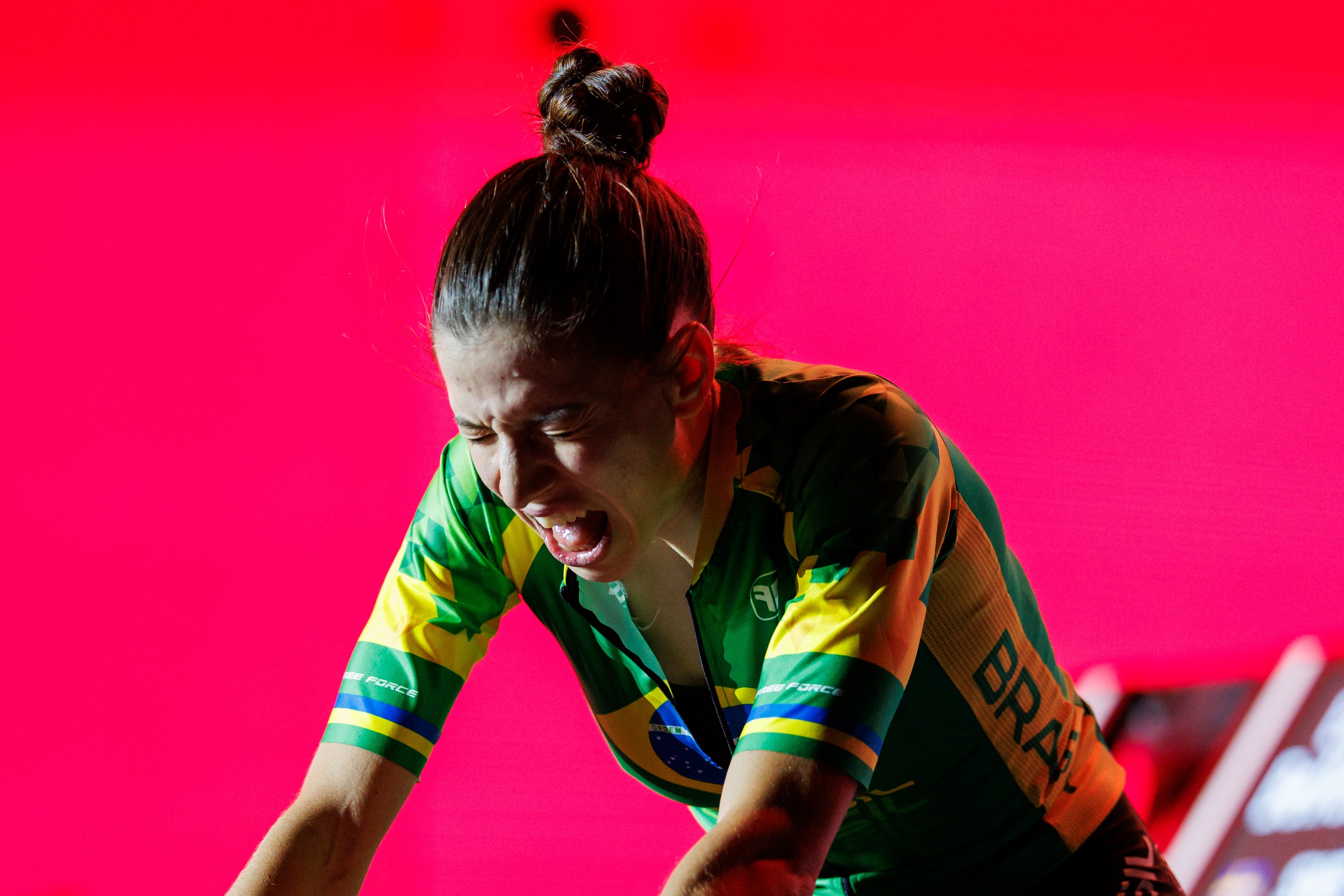 Gabriela Guerra racing indoors in a Brazil kit