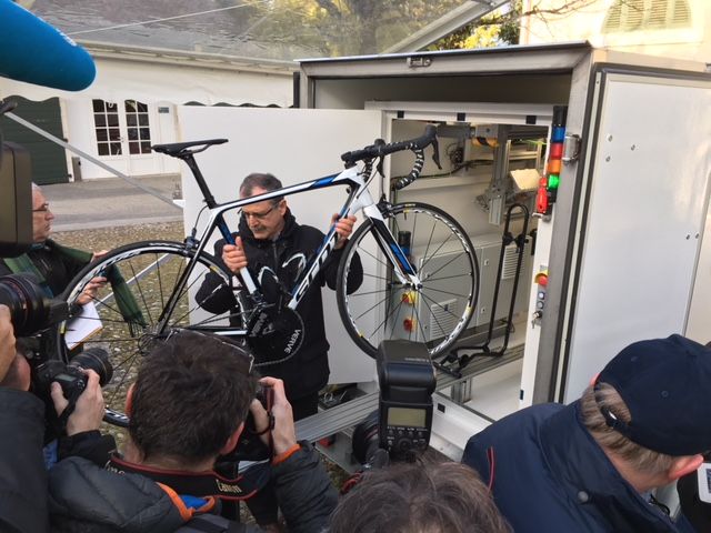 A UCI tech loads a bike into the new X-ray cabinet