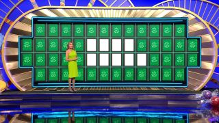 Vanna White stands in front of the board during the bonus round on Wheel of Fortune.