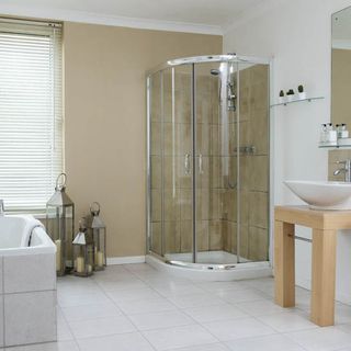 bathroom with white tiles on floor and shower area