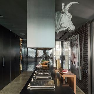 kitchen area with cow sculpture