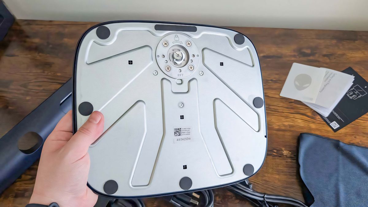 Alienware 34 Curved QD-OLED AW3425DW's base turned upside down with the built-in screw visible.