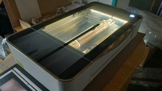 Glowforge Pro review, a laser cutter glows with a bright light